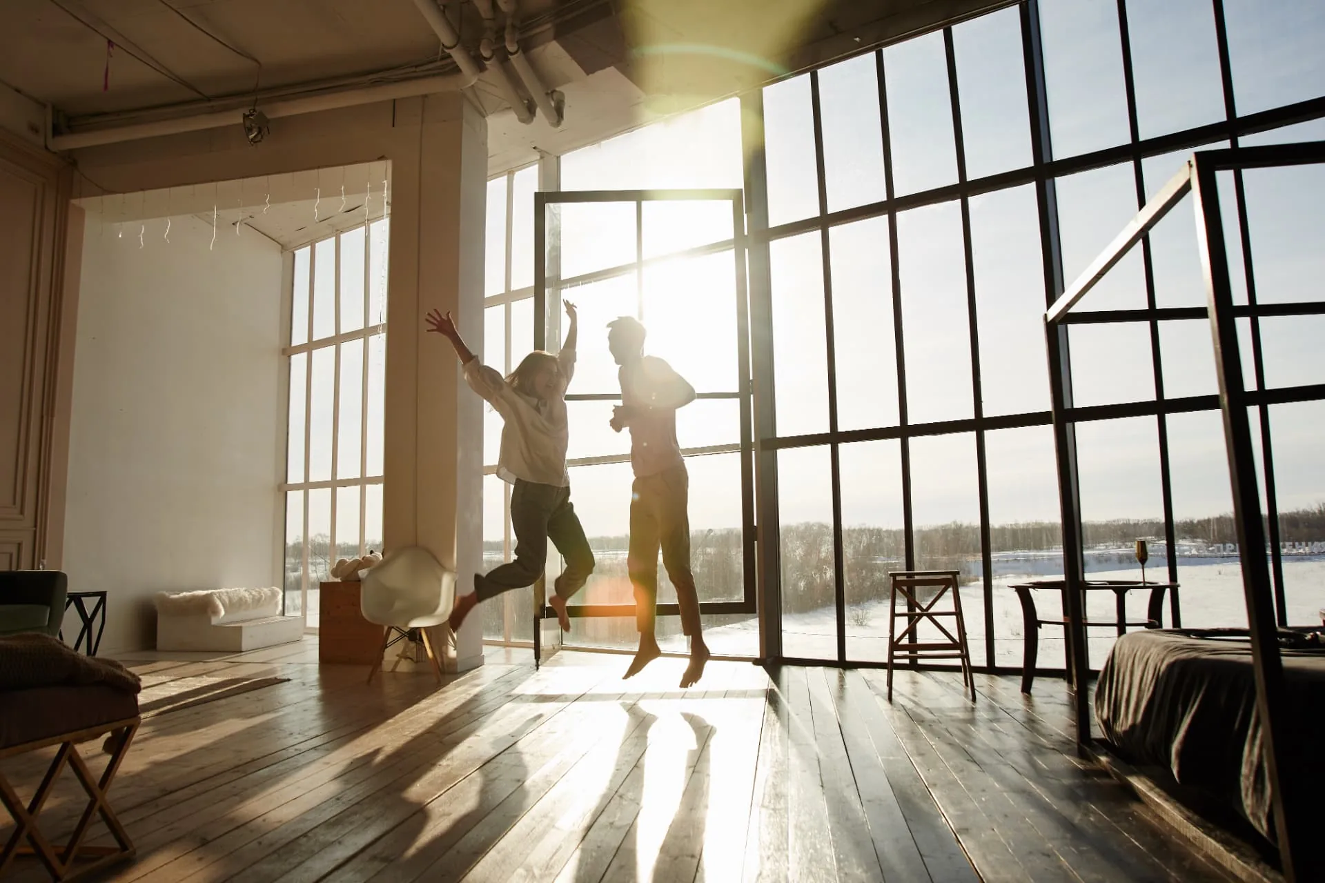 Homeowners on the porch of the home they bought with a Quick Mortgage home loan in Phoenix, Arizona